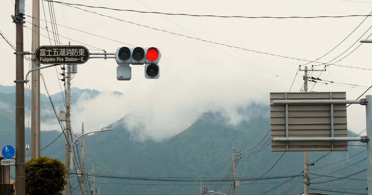 A rural Ontario volunteer fire hall on a quiet country road surrounded by autumn foliage